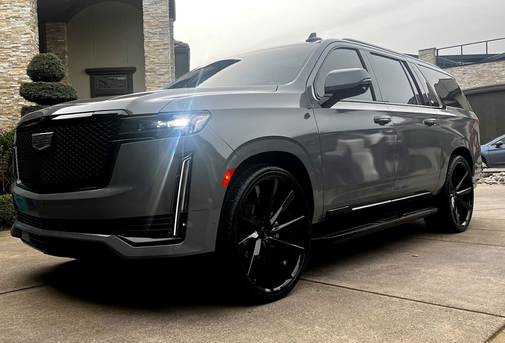 exterior detailing shop servicing a cadillac